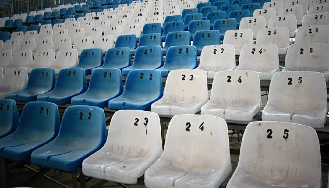 empty chairs in soccer stadium