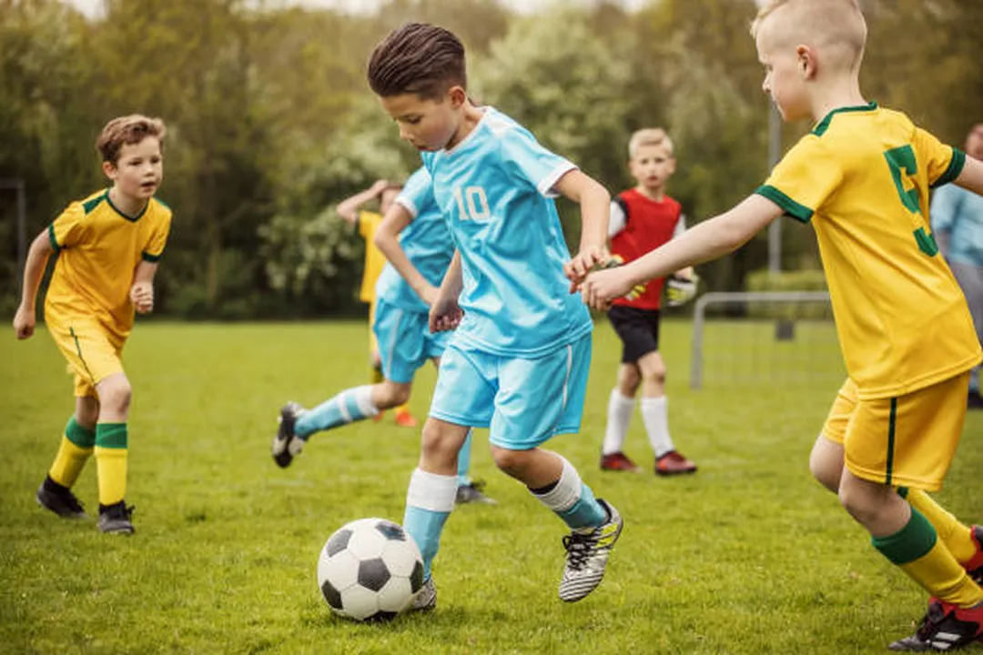 kids playing soccer in jerseys